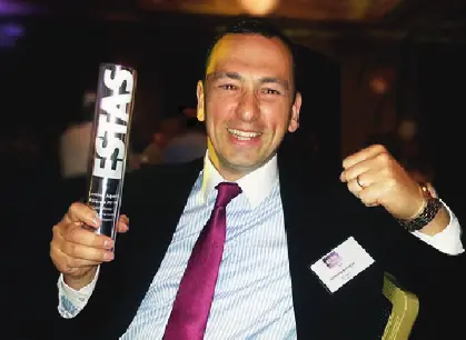 A member of the Kerrigans team holding an ESTAS award at the awards ceremony